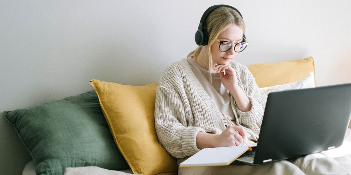 creative-writer-using-laptop-and-notebook